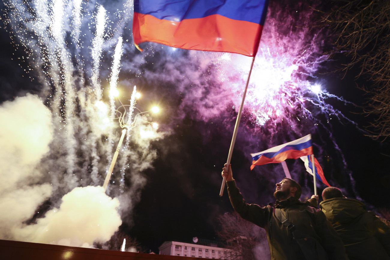 DONETSK, UKRAINE - FEBRUARY 21, 2022: Donetsk residents celebrate recognition of independence of the Donetsk and Lugansk People's Republics by Russia. Russian President Putin signed decrees recognizing independence of the Donetsk and Lugansk People's Republics on February 21, 2022. Alexander Ryumin/TASS (Photo by Alexander Ryumin\TASS via Getty Images)