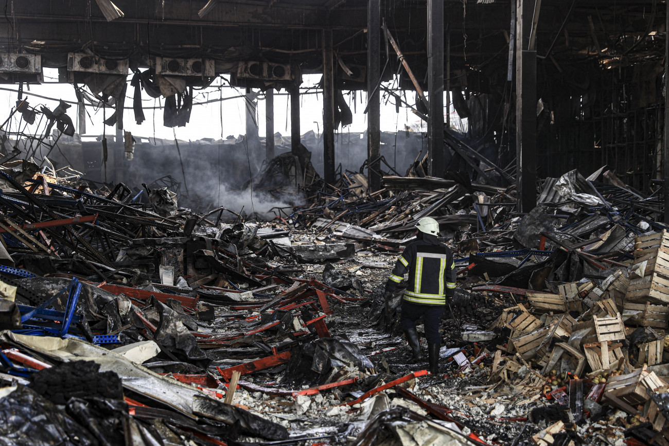 KYIV, UKRAINE - MARCH 29: Firefighters continue to cooling works at a completely destroyed logistics warehouse, where approximately 50 thousand tons of food became unusable, after it was hit by Russian shellings on 13th March, in Brovary district of Kyiv, Ukraine on March 29, 2022. (Photo by Metin Aktas/Anadolu Agency via Getty Images)