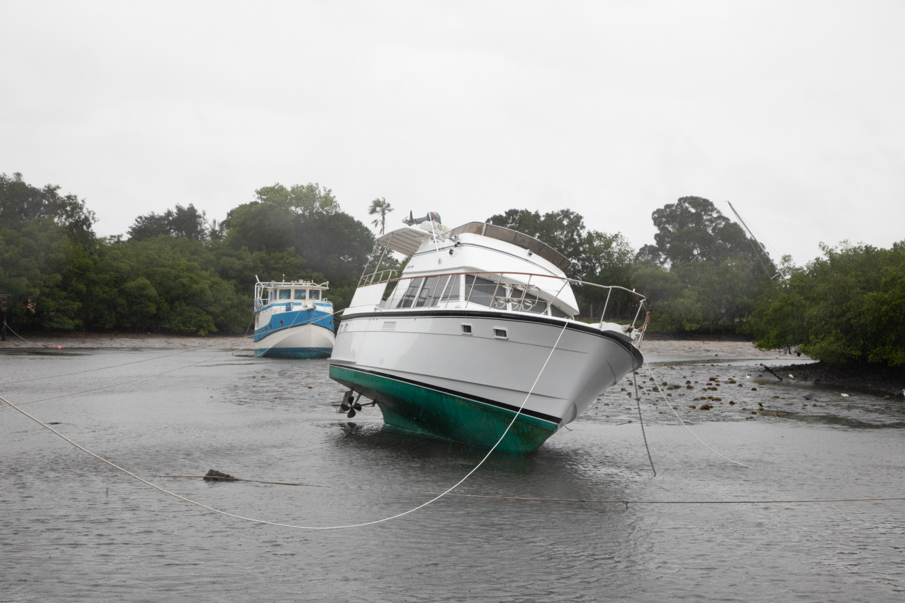 A boat sways in shallow water as Hurricane Ian approaches in the Coquina Key neighborhood of St. Petersburg, Florida, US, on Wednesday, Sept. 28, 2022. HurricaneÂ IanÂ rapidly gained strength -- with winds reaching 155 miles an hour -- as it barreled toward the coast of Florida, threatening to rip roofs off of homes, wreck agricultural crops and cripple infrastructure as one of the costliest storms to ever hit the US. Photographer:Tristan Wheelock/Bloomberg via Getty Images