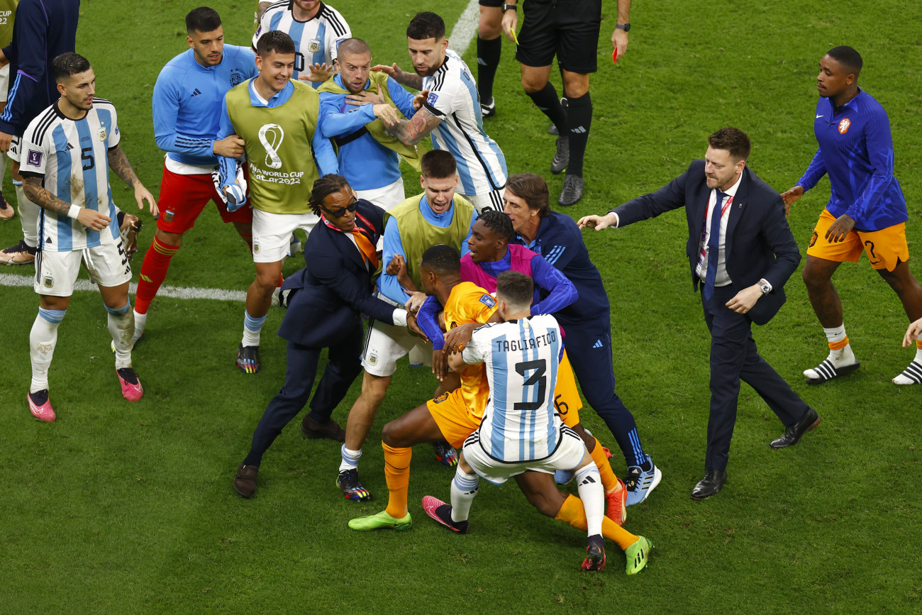 LUSAIL CITY, QATAR - DECEMBER 09: Denzel Dumfries #22 of Netherlands argues with Leandro Paredes #5 of Argentina during the FIFA World Cup Qatar 2022 quarter final match between Netherlands and Argentina at Lusail Stadium on December 9, 2022 in Lusail City, Qatar. (Photo by Fu Tian/China News Service/VCG via Getty Images)