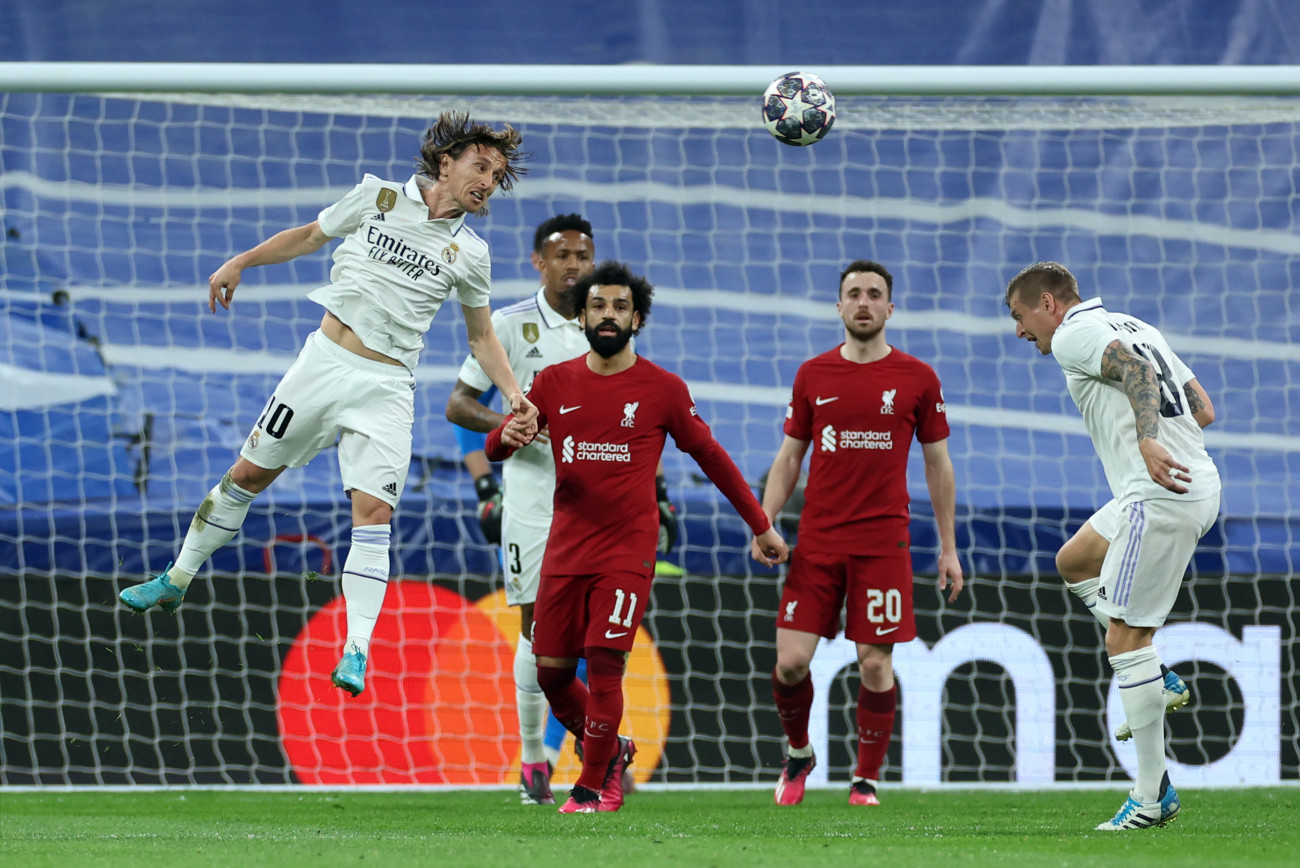 Real Madrid's Luka Modric (left) heads clear during the UEFA Champions League round of sixteen second leg match at the Santiago Bernabeu Stadium, Madrid. Picture date: Wednesday March 15, 2023. (Photo by Isabel Infantes/PA Images via Getty Images)