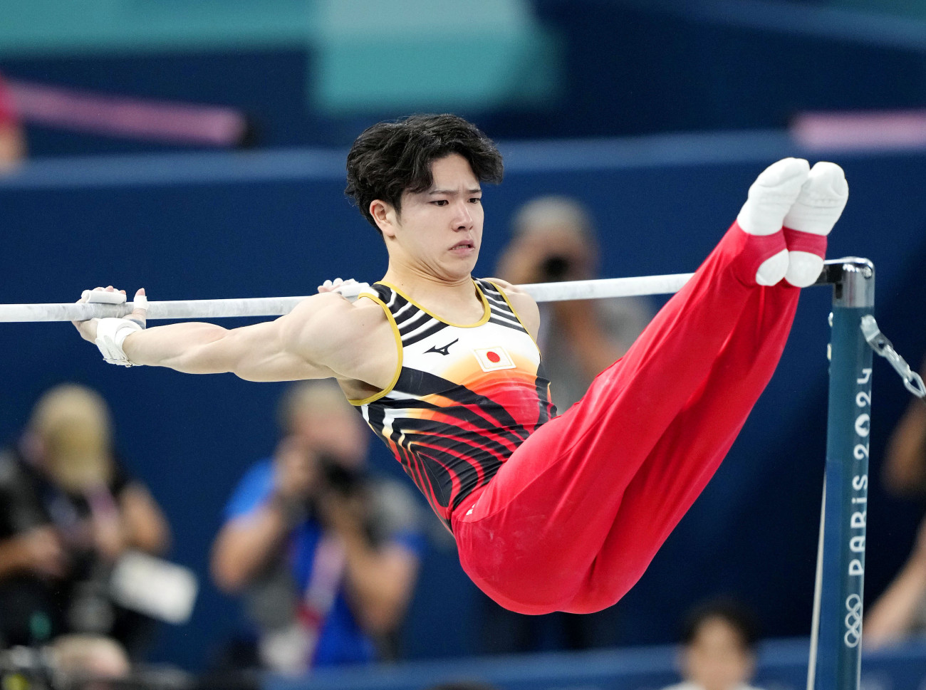 Shinnosuke Oka of Japan competes en route to winning gold in the men's artistic gymnastics horizontal bar at the Paris Olympics at Bercy Arena in Paris on Aug. 5, 2024. (Photo by Kyodo News via Getty Images)