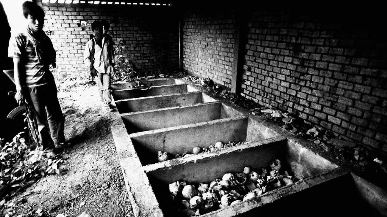 OUDONG, CAMBODIA - 1981/01/15: A soldier is standing by a mss grave of victims of the Pol Pot regime near the hills of the former Cambodian capital of Oudong, just 40 km North of Phnom Penh.
Cambodia. Pictures from the book YEARS OF TURMOIL.. (Photo by Roland Neveu/LightRocket via Getty Images)
