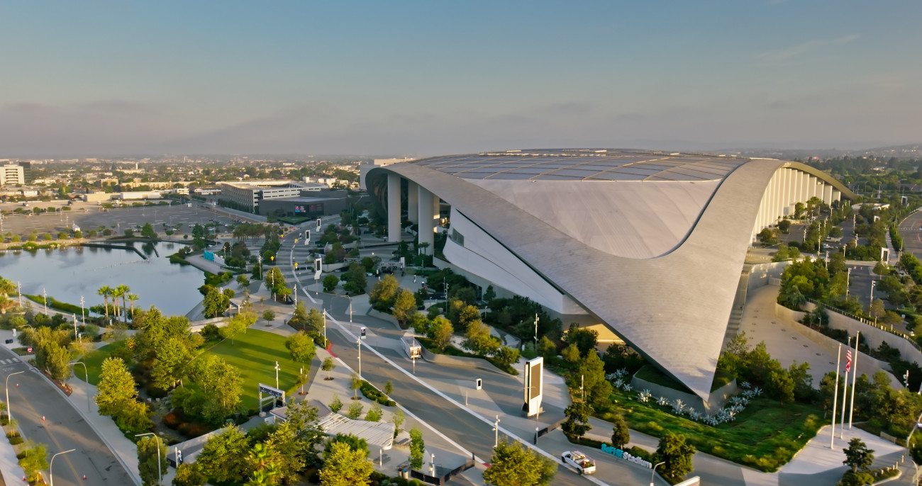 Inglewood, California, USA - July 23rd, 2024. Aerial shot of SoFi Stadium, a large sports stadium and concert venue in Inglewood, California, at sunrise. It is scheduled to host several matches of theÂ 2026 FIFA World Cup, Super Bowl LXIÂ in 2027, and the opening and closing ceremonies, soccer,Â and swimming events of theÂ 2028 Summer Olympics. 

Authorization was obtained from the FAA for this operation in restricted airspace.