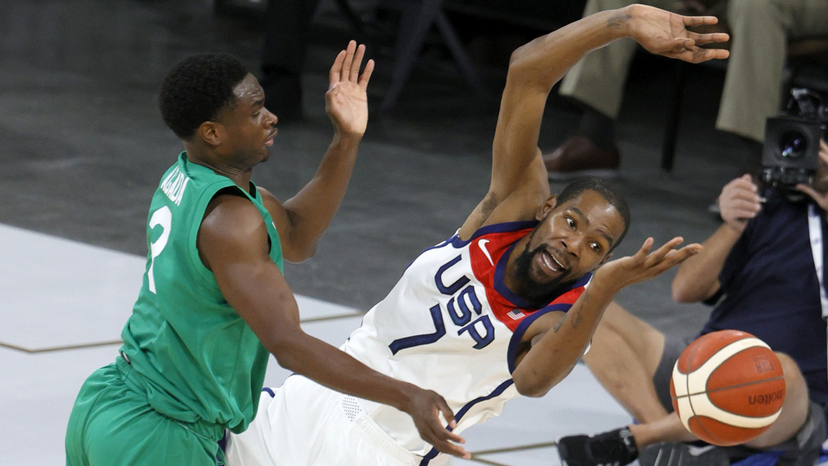 LAS VEGAS, NEVADA - JULY 10:  Caleb Agada #3 of Nigeria fouls Kevin Durant #7 of the United States during an exhibition game at Michelob ULTRA Arena ahead of the Tokyo Olympic Games on July 10, 2021 in Las Vegas, Nevada. Nigeria defeated the United States 90-87.  (Photo by Ethan Miller/Getty Images)