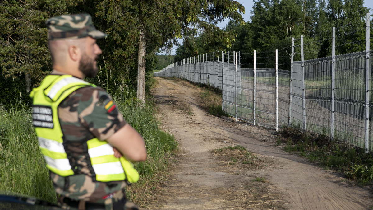 POSKONYS, LITHUANIA - JUNE 21: Lithuania State Border guard Vytautas Makauskas stands on patrol near the Lithuania-Belarus border line on June 21, 2021 near Poskonys, Lithuania. The Lithuanian government has accused the President of Belarus, Alexander Lukashenko, of illegally allowing refugees from the Middle East trying to reach Europe to pass through itsÂ borders. Lithuanian foreign minister Gabrielius Landsbergis said the Belarusian leader is using migration as a weapon against the European Union, which has adopted sanctions against him and the nation. (Photo by Paulius Peleckis/Getty Images)