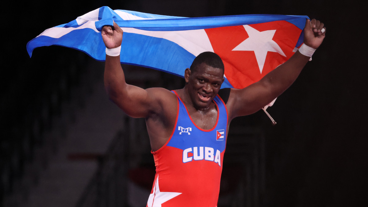 02 August 2021, Japan, Chiba: Wrestling/Freestyle: Olympics, 130 kg/Greek-Roman, Men, Final at Makuhari Messe Hall A. Mijain Lopez Nunez (Cuba) celebrates with the flag after the victory. Photo: Jan Woitas/dpa-Zentralbild/dpa (Photo by Jan Woitas/picture alliance via Getty Images)