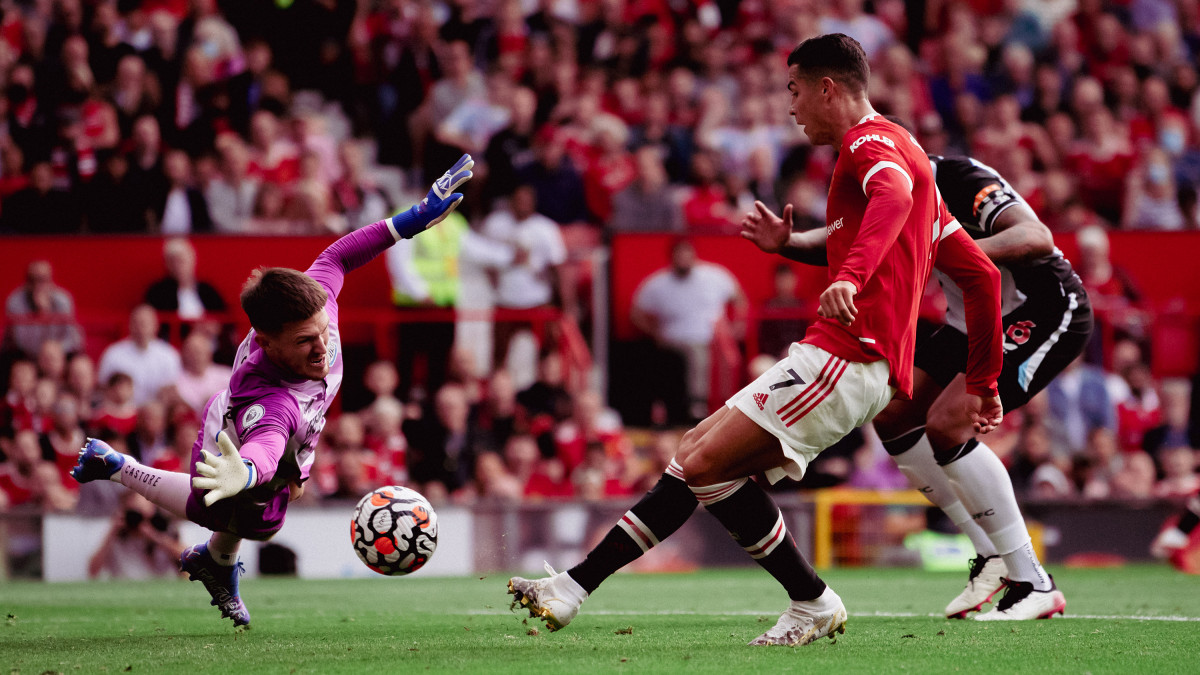 MANCHESTER, ENGLAND - SEPTEMBER 11: Cristiano Ronaldo of Manchester United scores their first goal during the Premier League match between Manchester United and Newcastle United at Old Trafford on September 11, 2021 in Manchester, England. (Photo by Ash Donelon/Manchester United via Getty Images)