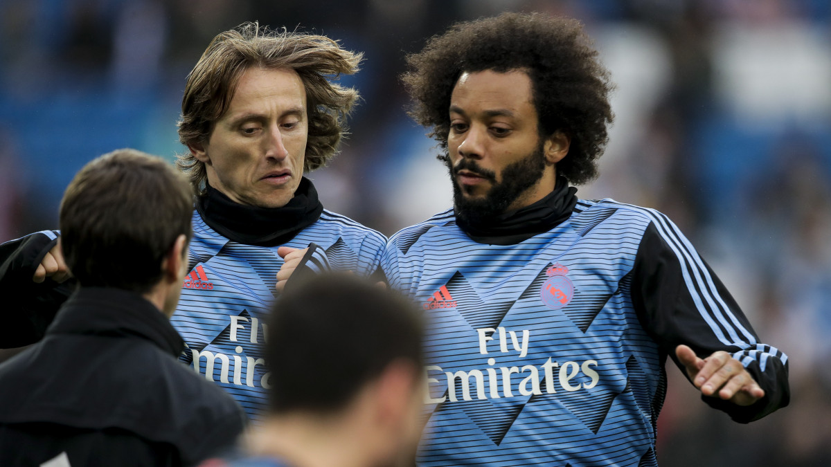 MADRID, SPAIN - JANUARY 18: (L-R) Luka Modric of Real Madrid, Marcelo of Real Madrid during the La Liga Santander  match between Real Madrid v Sevilla at the Santiago Bernabeu on January 18, 2020 in Madrid Spain (Photo by David S. Bustamante/Soccrates/Getty Images)