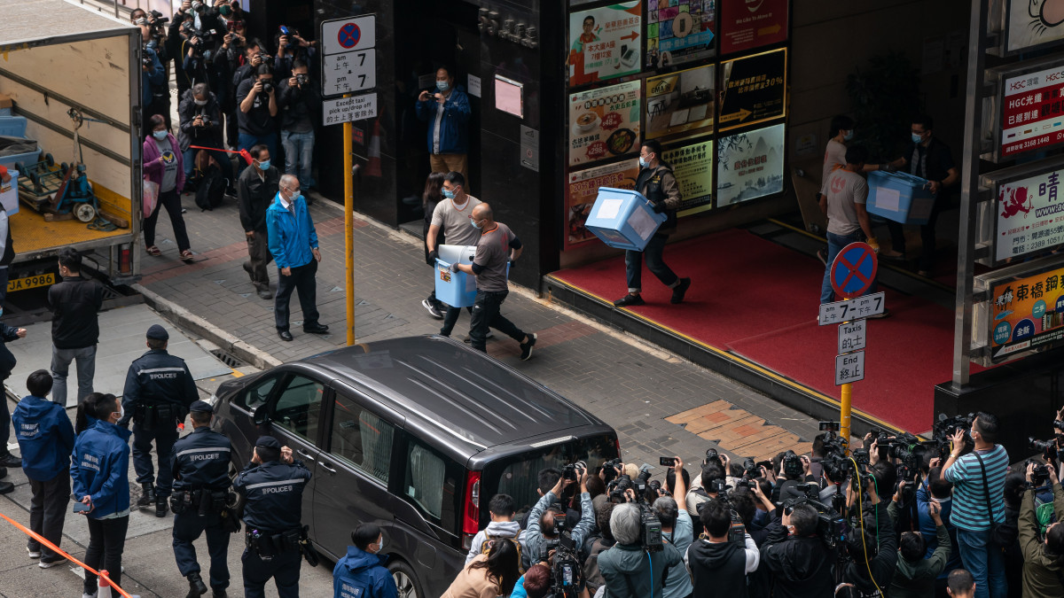 HONG KONG, CHINA - DECEMBER 29:  Boxes are loaded onto a truck from the offices of Stand News after police searched the premises of the independent news outlet on December 29, 2021 in Hong Kong, China. Editors, board members and a pop singer were arrested in the early morning sweep as 200 officers raided the office. (Photo by Anthony Kwan/Getty Images)