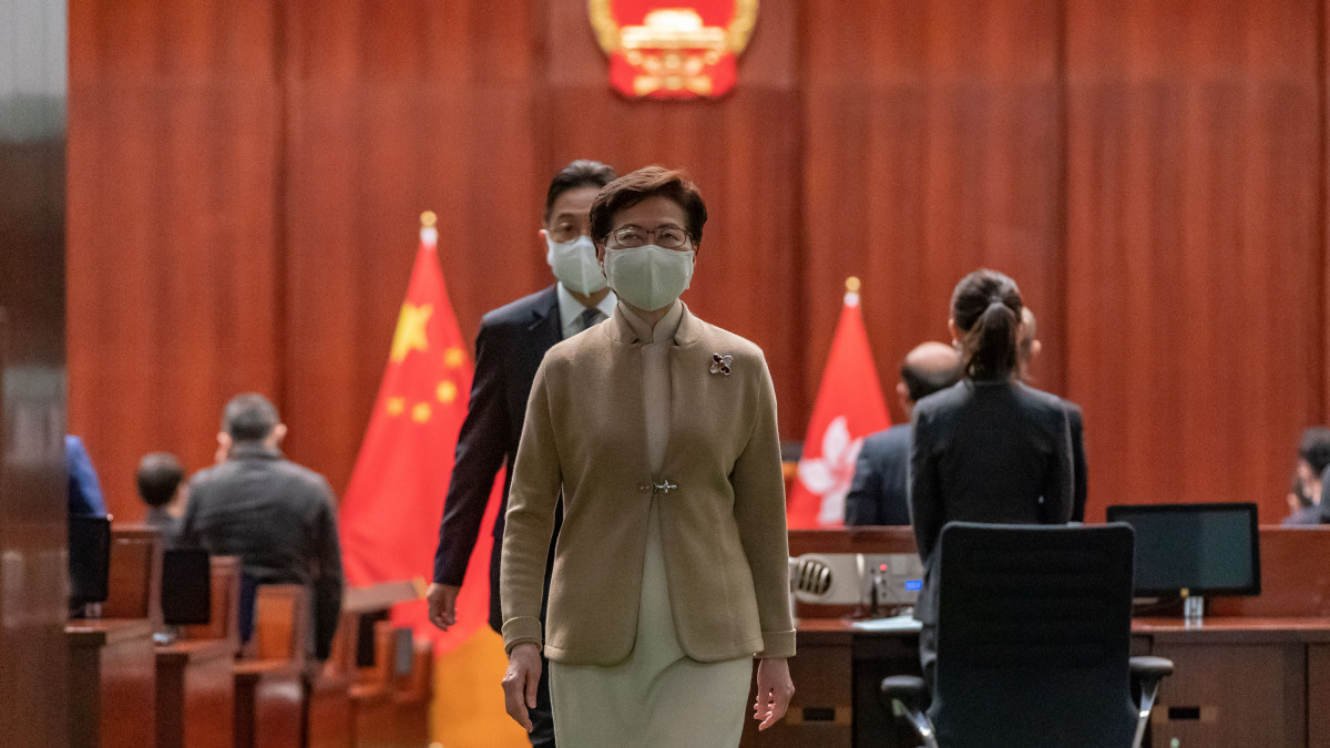 HONG KONG, CHINA - JANUARY 03: Hong Kong Chief Executive Carrie Lam leaves the Legislative Council main chamber after a oath-swearing ceremony on January 3, 2022 in Hong Kong, China. Hong Kongs Legislative Council is welcoming new members at a ceremony today, following a revamp of the electoral system by Beijing to ensure only âpatriotsâ hold political power. (Photo by Anthony Kwan/Getty Images)