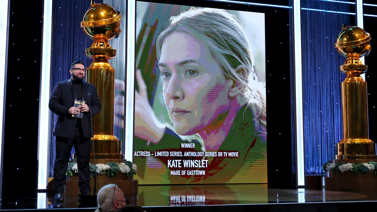 BEVERLY HILLS, CALIFORNIA - JANUARY 09: HFPA Grantee and Outfest Executive Director Damien S. Navarro presents the Best Actress in a Limited Series or TV Movie Award onstage during the 79th Annual Golden Globe Awards at The Beverly Hilton on January 09, 2022 in Beverly Hills, California. (Photo by Emma McIntyre/Getty Images for Hollywood Foreign Press Association)