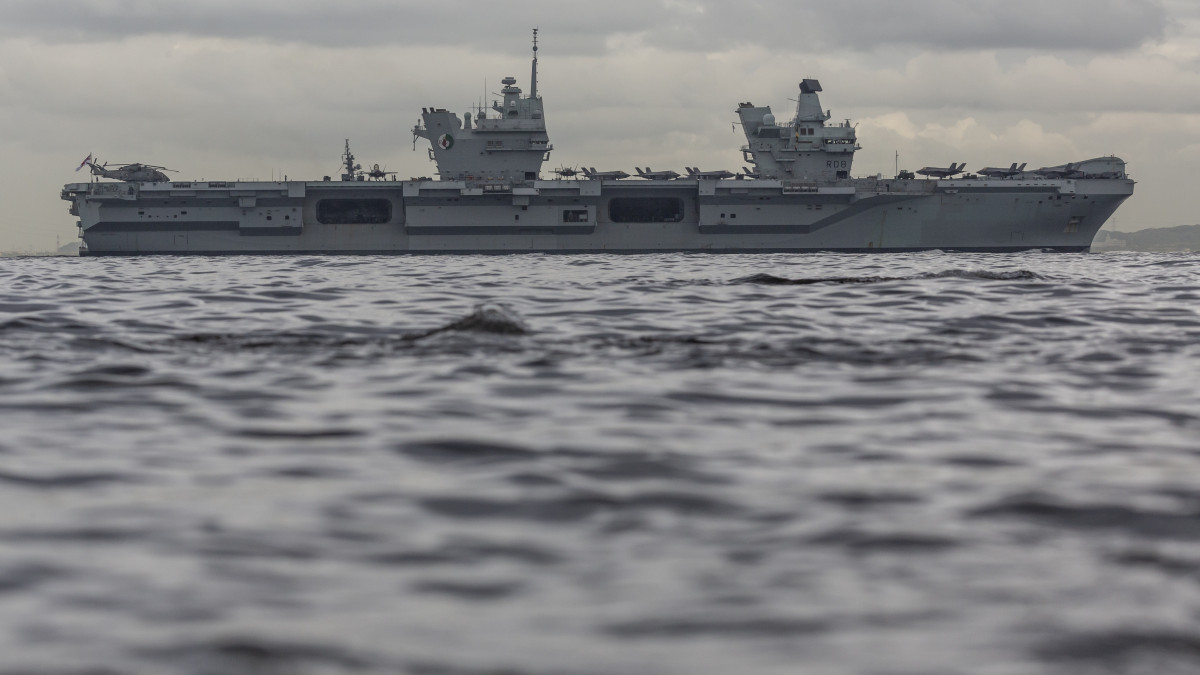 YOKOSUKA, JAPAN - SEPTEMBER 08: The British Royal Navy aircraft carrier HMS Queen Elizabeth sails out of Tokyo bay on September 08, 2021 in Yokosuka, Japan. The visit by the Royal Navys flagship vessel took place on the second leg of the ships maiden deployment and involved joint exercises with Japans Self-Defense Forces as well as the U.S and Dutch navies. (Photo by Yuichi Yamazaki/Getty Images)