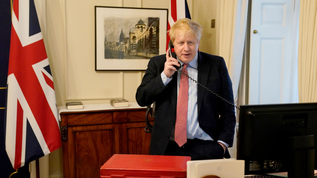 LONDON, ENGLAND - MARCH 25: Prime Minister Boris Johnson on the telephone to Queen Elizabeth II for her Weekly Audience during the coronavirus (COVID-19) pandemic at 10 Downing Street on March 25, 2020 in London, England. (Photo by Andrew Parsons-WPA Pool/Getty Images)