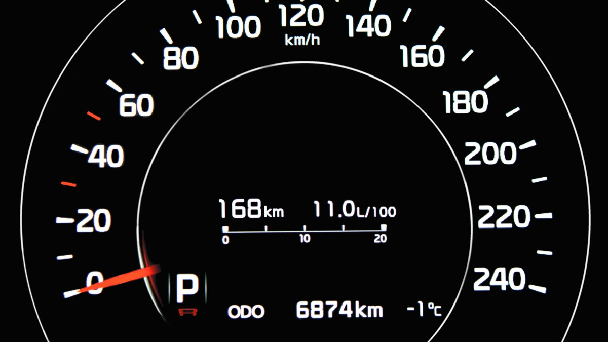 Digital car speedometer on the black background
