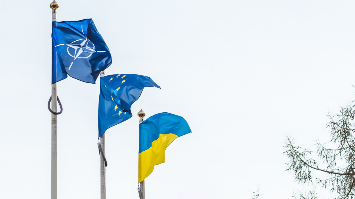 Vilnius, Lithuania - February 16 2022: Flag of NATO, European Union and Ukraine waving together in the sky