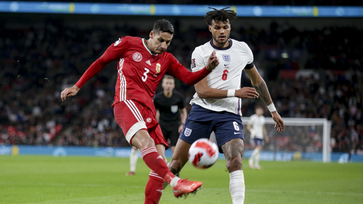 LONDON, ENGLAND - OCTOBER 12: Akos Kecskes of Hungary clears from Tyrone Mings of England during the 2022 FIFA World Cup Qualifier match between England and Hungary at Wembley Stadium on October 12, 2021 in London, England. (Photo by Robin Jones/Getty Images)