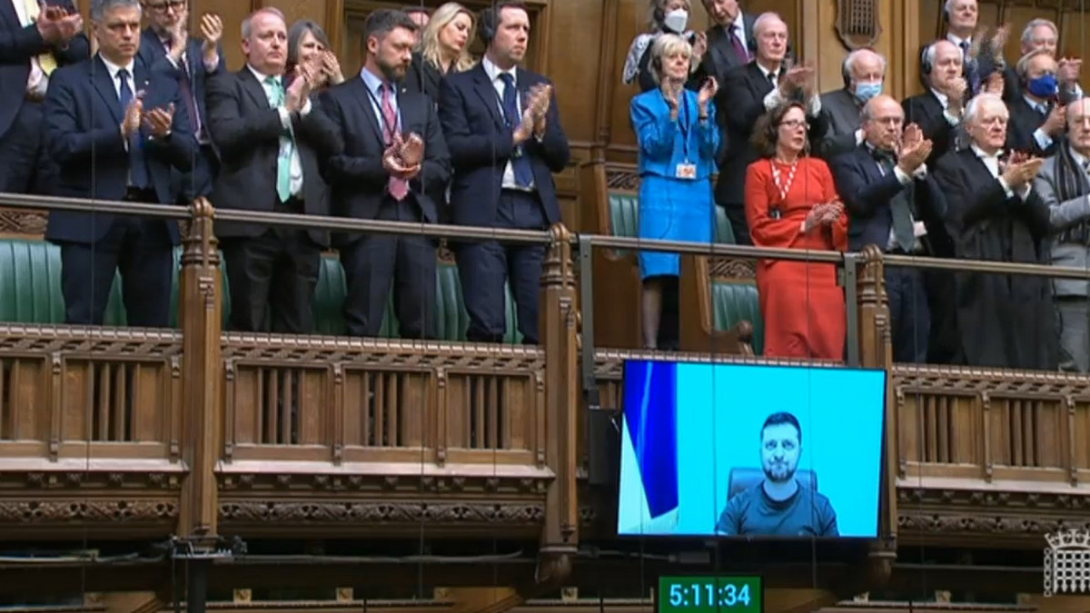 Ambassador of Ukraine to the UK, Vadym Prystaiko (left) and MPs give a standing ovation after Ukrainian President Volodymyr Zelensky addressed MPs in the House of Commons via videolink on the latest situation in Ukraine. Picture date: Tuesday March 8, 2022. (Photo by House of Commons/PA Images via Getty Images)