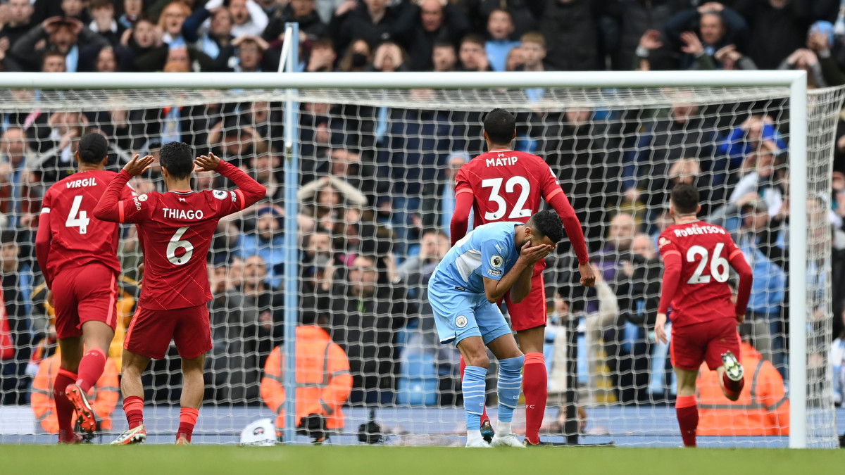 MANCHESTER, ENGLAND - APRIL 10: Riyad Mahrez of Manchester City reacts after a missed chance during the Premier League match between Manchester City and Liverpool at Etihad Stadium on April 10, 2022 in Manchester, England. (Photo by Shaun Botterill/Getty Images)