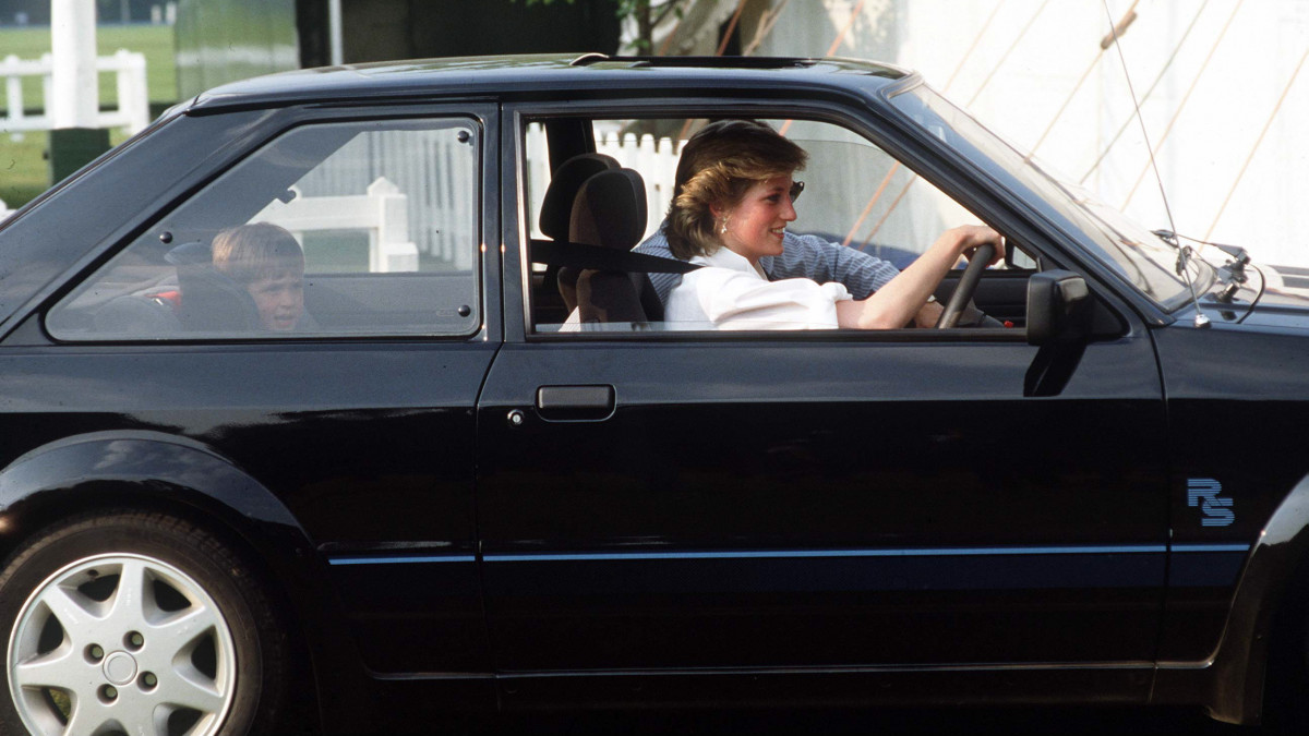 WINDSOR, UNITED KINGDOM - JUNE 20:  Princess Diana Driving Her Ford Escort With Prince William Sitting In A Special Car Seat Behind (date Not Certain)  (Photo by Tim Graham Photo Library via Getty Images)