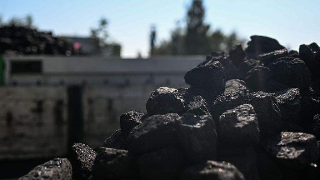 JAWORZNO, POLAND - SEPTEMBER 08: A man organizes coal on a truck that was bought from the Sobieski coal mine on September 08, 2022 in Jaworzno, Poland. Despite being the second-largest coal producer in Europe, Poland imported 12 million tons of coal last year, two-thirds of which came from Russia and was used by households and small heating plants. The embargo on Russian coal, imposed earlier this year after Moscows invasion of Ukraine, has caused coal shortages and price rises in Poland. (Photo by Omar Marques/Getty Images)