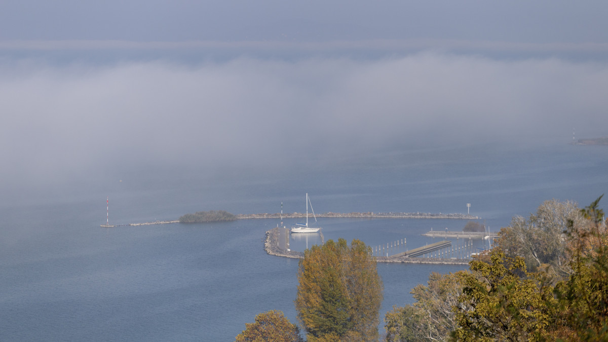 View of the foggy Balaton from Fonyod promenade on an autumn day.