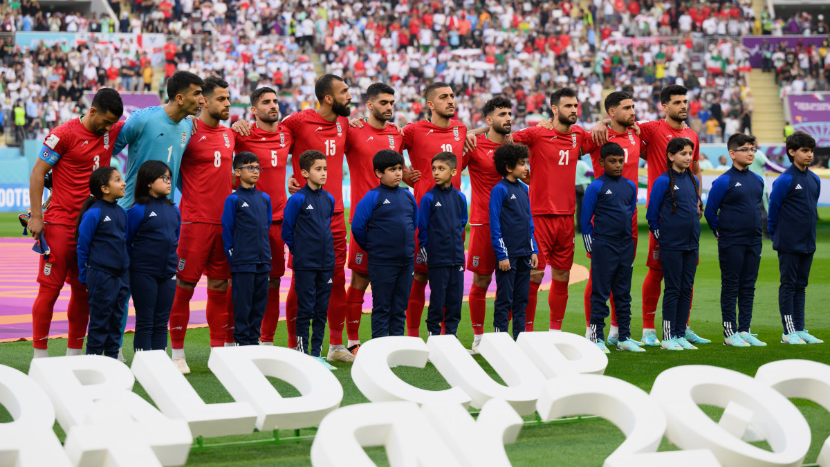 DOHA, QATAR - NOVEMBER 21: Iranian players line up for the national anthem prior to the FIFA World Cup Qatar 2022 Group B match between England and IR Iran at Khalifa International Stadium on November 21, 2022 in Doha, Qatar. (Photo by Matthias Hangst/Getty Images)