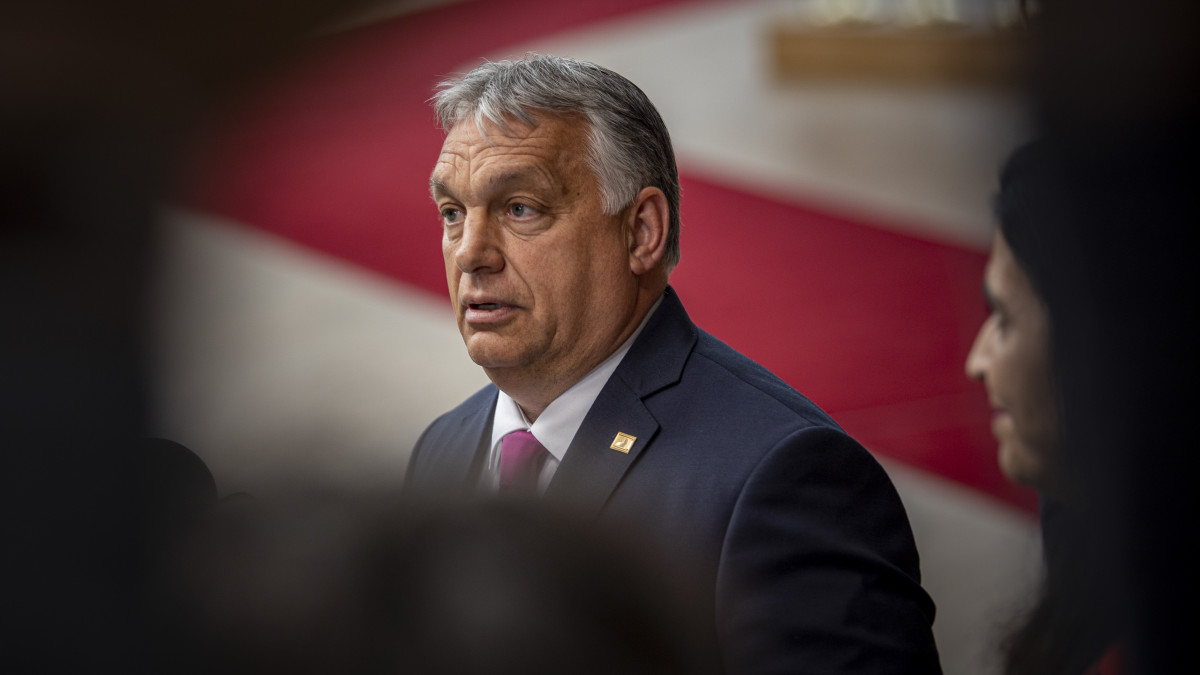 Viktor Orban Prime Minister of Hungary arrives at the special EU summit, walking next to the European flags behind the flag of Europe and talks to the media about the Russian sanctions. Special Meeting of the EU leaders, the European Council in Brussels, Belgium on May 30, 2022 (Photo by Nicolas Economou/NurPhoto via Getty Images)