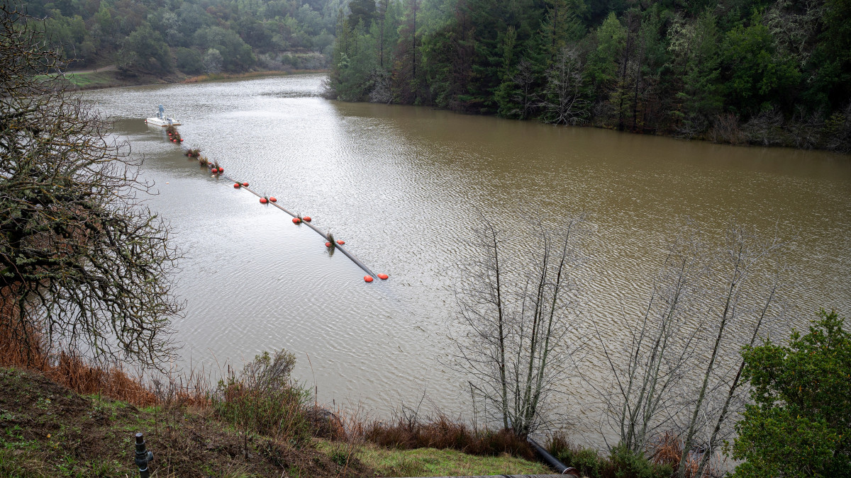 A pump operates on Phoenix Lake in Ross, California, US, on Friday, Dec. 30, 2022. A potent weather system known as an atmospheric river is poised to bring heavy rain and snow to the Pacific Northwest and California, raising the risk of mudslides and floods. Photographer: David Paul Morris/Bloomberg via Getty Images