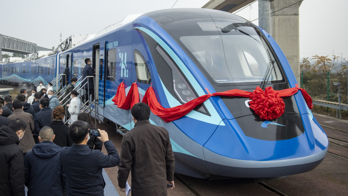 CHENGDU, CHINA - DECEMBER 28: People line up to board the worlds first hydrogen energy urban train at a branch of CRRC Changchun Railway Vehicles Co., Ltd on December 28, 2022 in Chengdu, Sichuan Province of China. The hydrogen-powered train, with a maximum speed of 160 kilometers per hour, was jointly developed by CRRC Changchun Railway Vehicles Co., Ltd and Chengdu Rail Transit Group Co., Ltd. (Photo by Liu Zhongjun/China News Service/VCG via Getty Images)