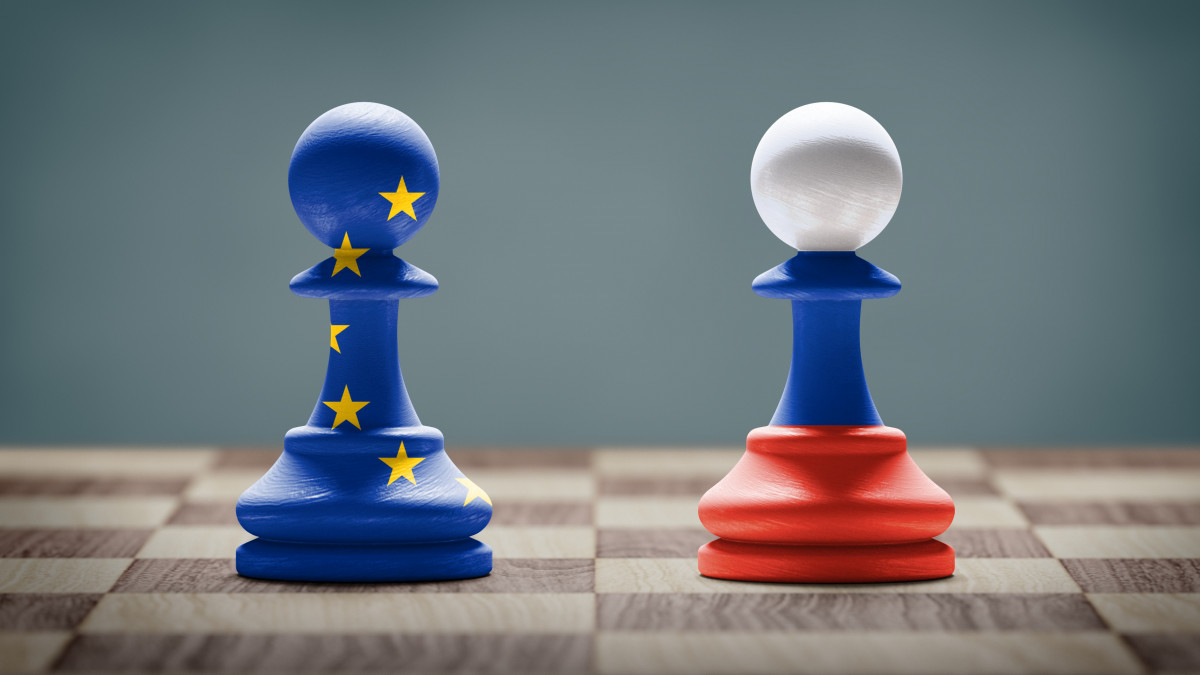 European Union and Russia conflict. Flags on chess pawns on a chess board.