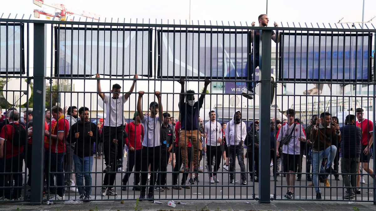 People try to climb gates outside the ground as the kick off is delayed during the UEFA Champions League Final at the Stade de France, Paris. Picture date: Saturday May 28, 2022. (Photo by Adam Davy/PA Images via Getty Images)