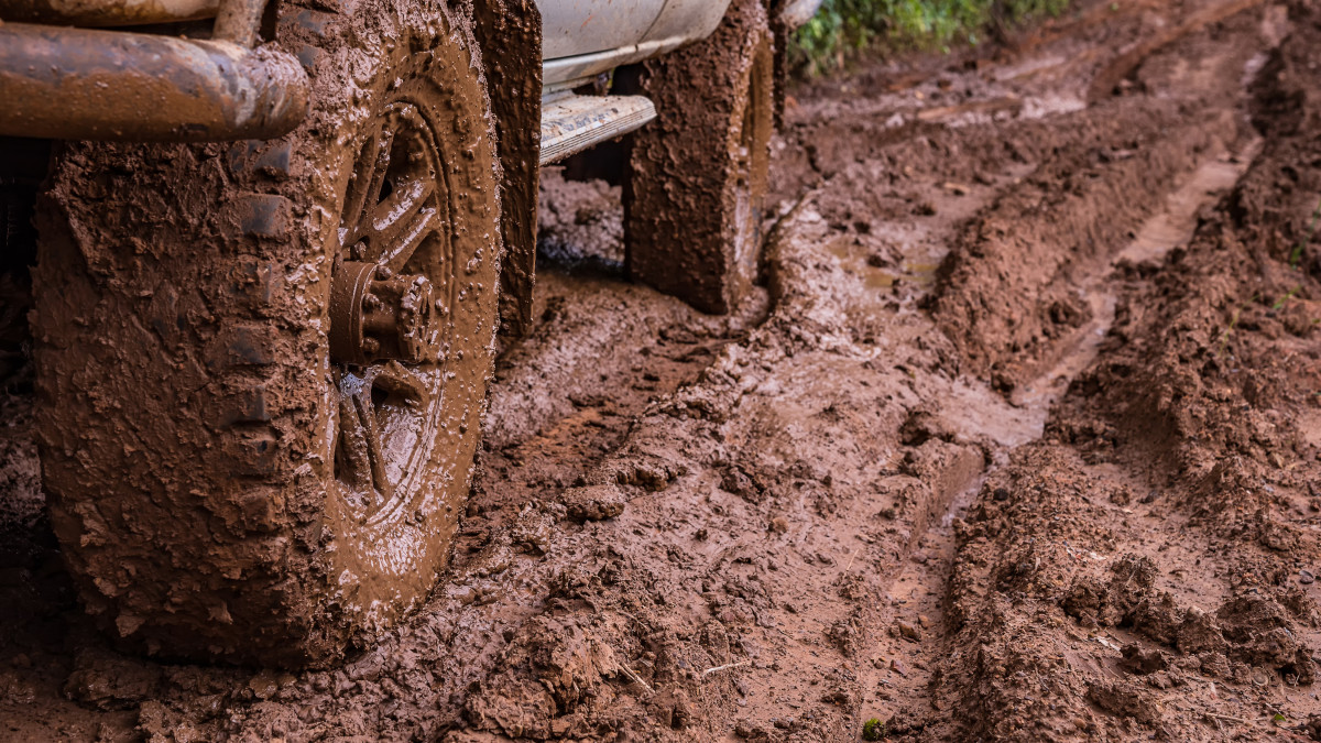 Tire tracks on a muddy road in the countryside, Routing traffic in the countryside.