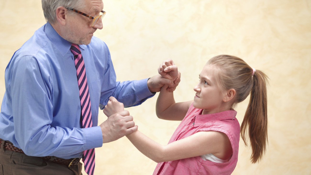 Pupil fighting with teacher