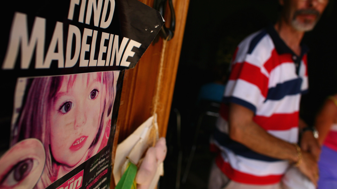 LAGOS, PORTUGAL - AUGUST 10:  A man looks at a poster placed on the Church door in Praia da Luz for missing Madeleine McCann August 10, 2007 in Praia da Luz, Portugal. Police continuing their investigations in the Algarve village after blood was found in the McCann Apartment.  (Photo by Jeff J Mitchell/Getty Images)