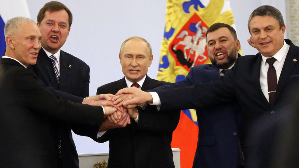 MOSCOW, RUSSIA - SEPTEMBER 30: (RUSSIA OUT) Russian President Vladimir Putin (C) with Ukrainian separatist regional leaders Vladimir Saldo (L), Yevgeniy Balitsky (2L), Leonid Pasechnik (R) and Denis Pushilin (2R) seen during the annexation ceremony of four Ukrainian regions at the Grand Kremlin Palace, September 30, 2022, in Moscow, Russia. Separatist leaders of annexed Donetsk, Lugansk, Kherson and Zaporizhzhya regions of Ukriane has arrived in Moscow to sign joint documents. (Photo by Contributor/Getty Images)