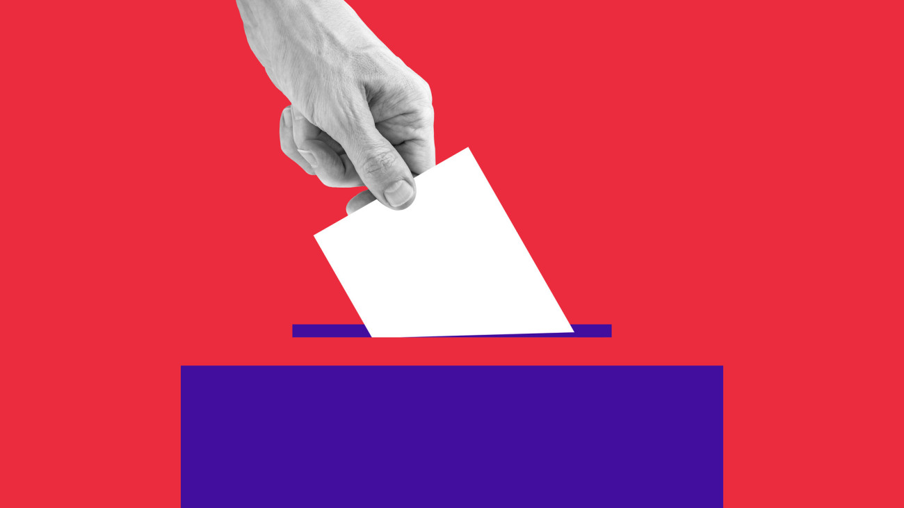 The human hand drops the ballot into the box. Getty Images