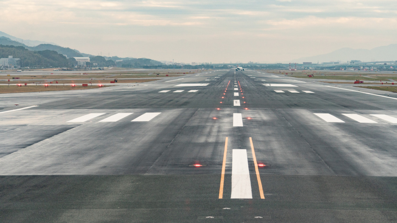 The photo was taken from left side of window of commercial airplane, Fukuoka International Airport (FUK) to Tokyo Haneda International Airport (HND) in the daytime.