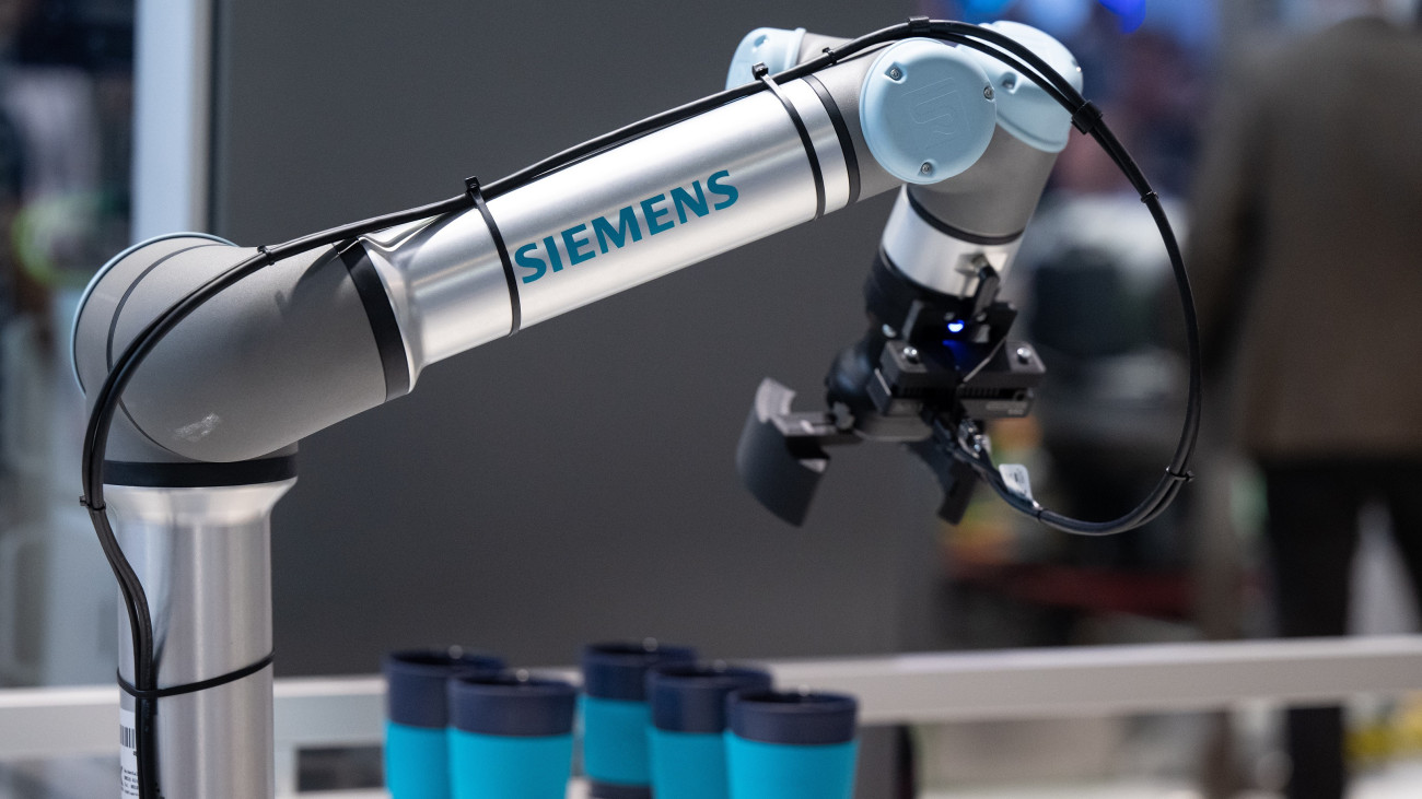 28 June 2023, Bavaria, Munich: A robot arm from Siemens is on display at Automatica 2023 in a hall at Messe MĂźnchen. Automatica is the leading trade fair for intelligent automation and robotics. Photo: Sven Hoppe/dpa (Photo by Sven Hoppe/picture alliance via Getty Images)