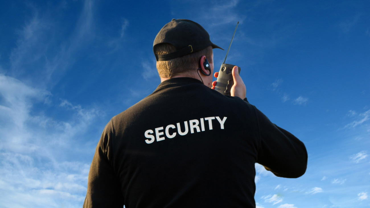 back of a security guard isolated on white