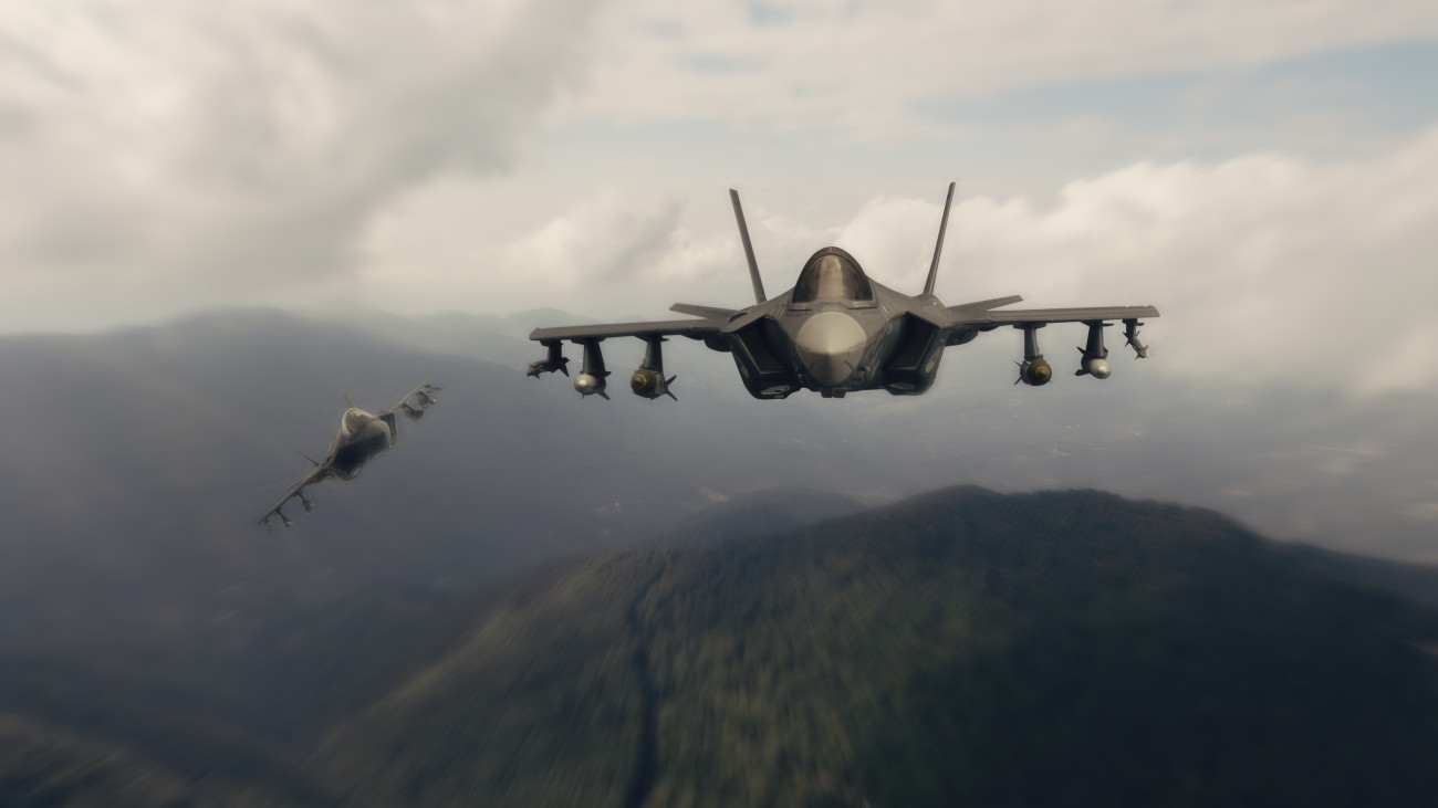F-35 Lightning II aircrafts flying over mountains.