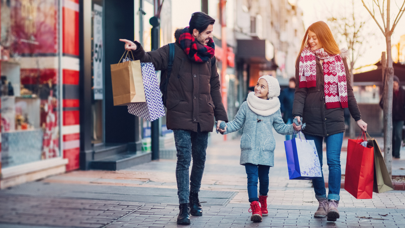 Family with one kid shopping together