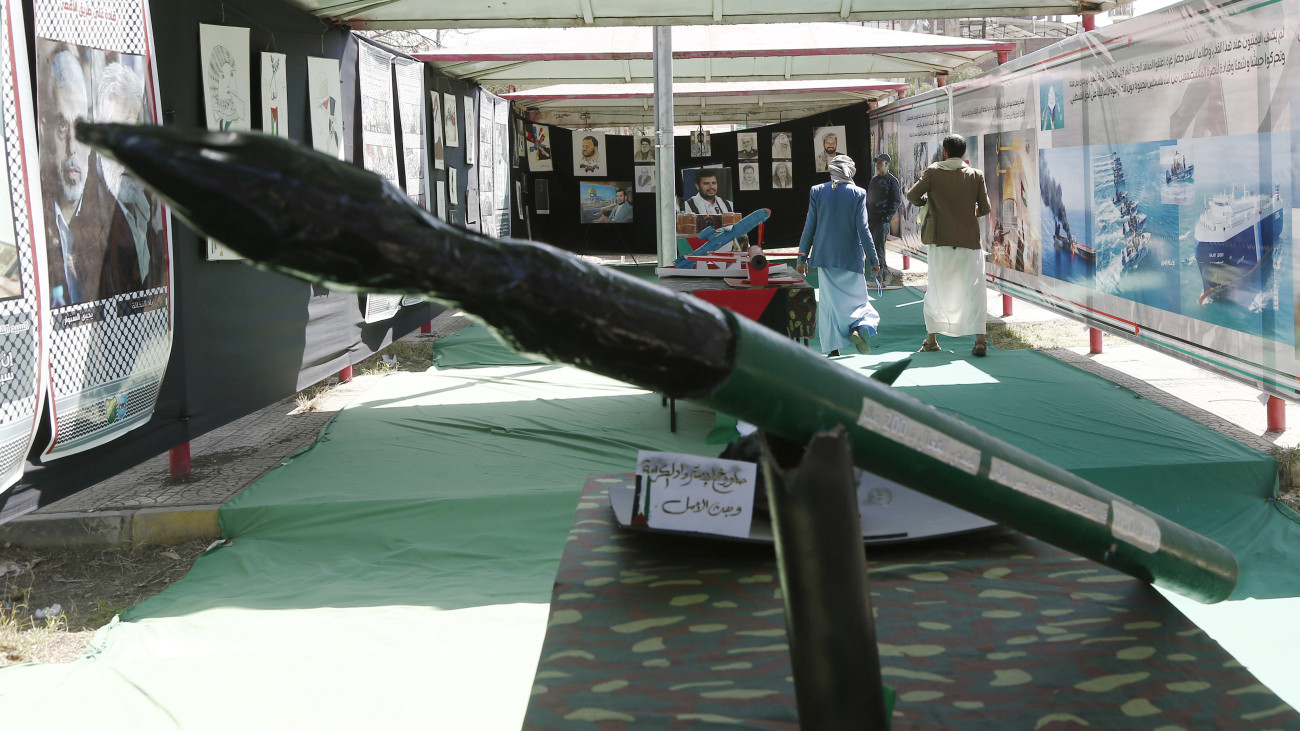 SANAA, YEMEN - JANUARY 31: Men walk near mock models of missiles and drones, displayed during an exhibition launched in solidarity with Palestinians and against the Israeli sustained bombardment in Gaza on January 31, 2024, in Sanaa, Yemen. (Photo by Mohammed Hamoud/Getty Images)