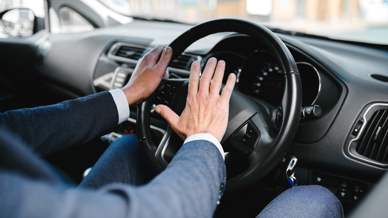 Cropped shot of an unrecognizable businessman pressing is horn while on his morning commute to work