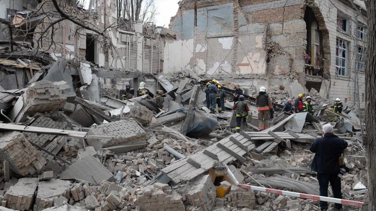 KYIV, UKRAINE - MARCH 25: Firefighters conduct operations in the rubble of heavily damaged building, part of which collapsed, following the Russian rocket attacks in Kyiv, Ukraine on March 25, 2024. Serhiy Popko, the head of the Kyiv City Military Administration, in his statement on the administrations social media account, stated that the Russian army carried out a missile attack on Kiev for the third time in the last 5 days. Noting that some buildings were damaged in Pechersk, Solomen, Dnipro and Golosiyiv districts, where missile fragments fell, Popko stated that 4 people, including a child, were injured. (Photo by Danylo Antoniuk/Anadolu via Getty Images)