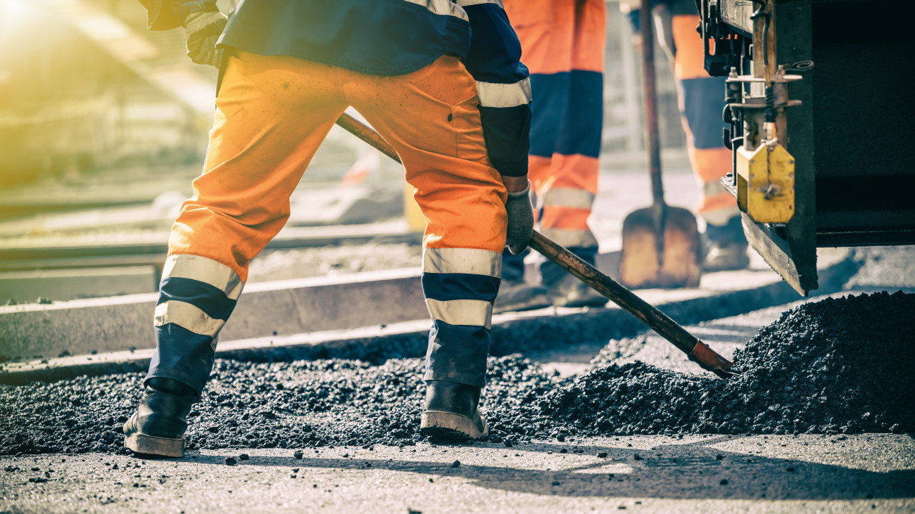 Teamwork, Group of workers on a road construction, team of people at work