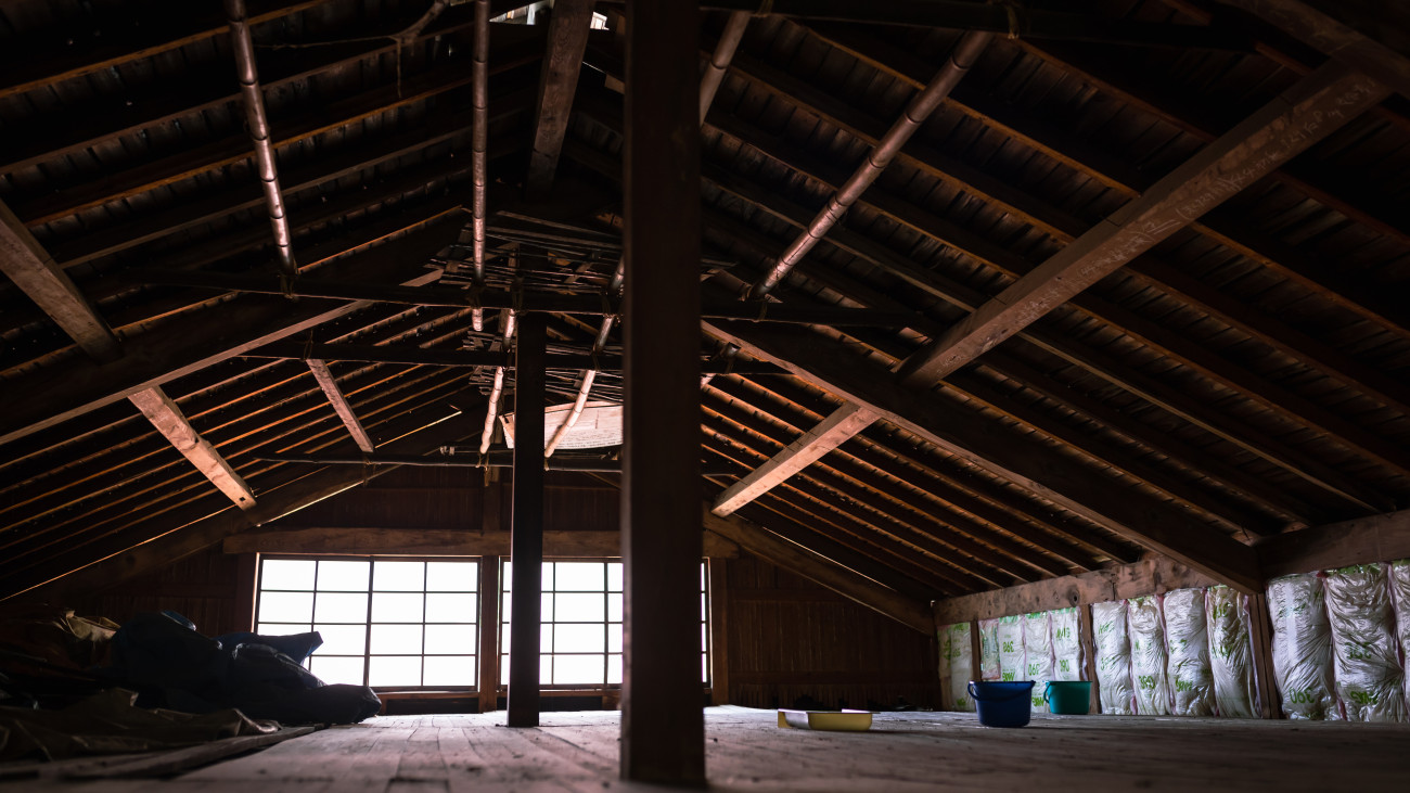 Men renovating an old house in rural Japan.