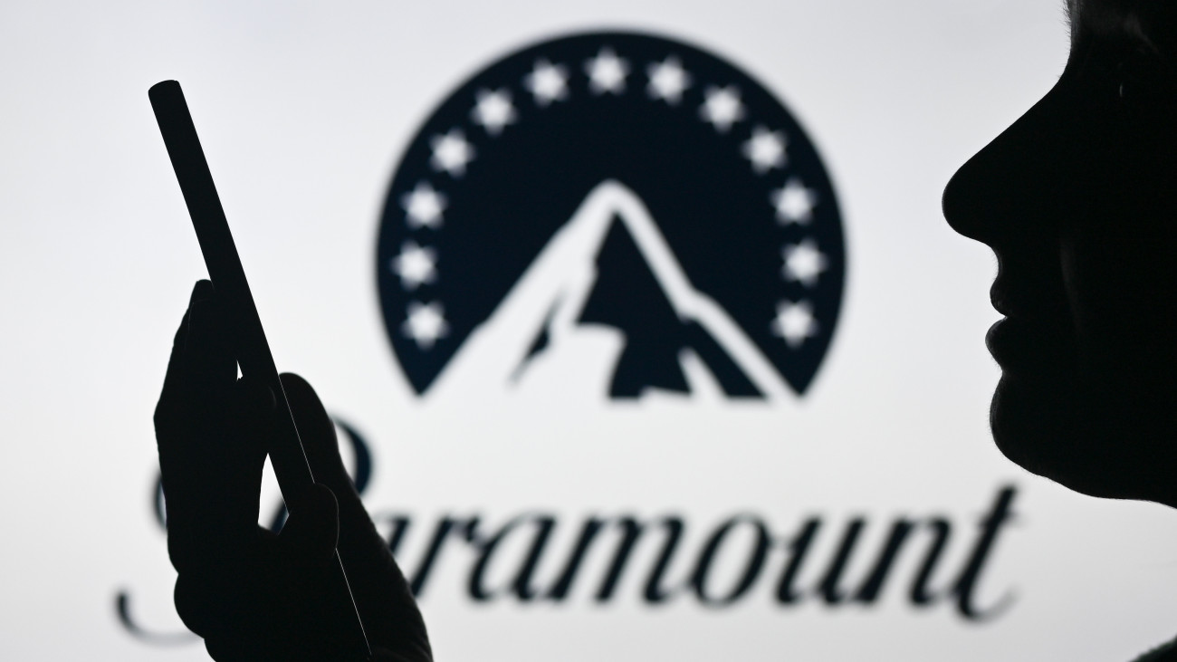 EDMONTON, CANADA - APRIL 28:An image of a woman holding a cell phone in front of the Paramount logo displayed on a computer screen, on April 29, 2024, in Edmonton, Canada. (Photo by Artur Widak/NurPhoto via Getty Images)