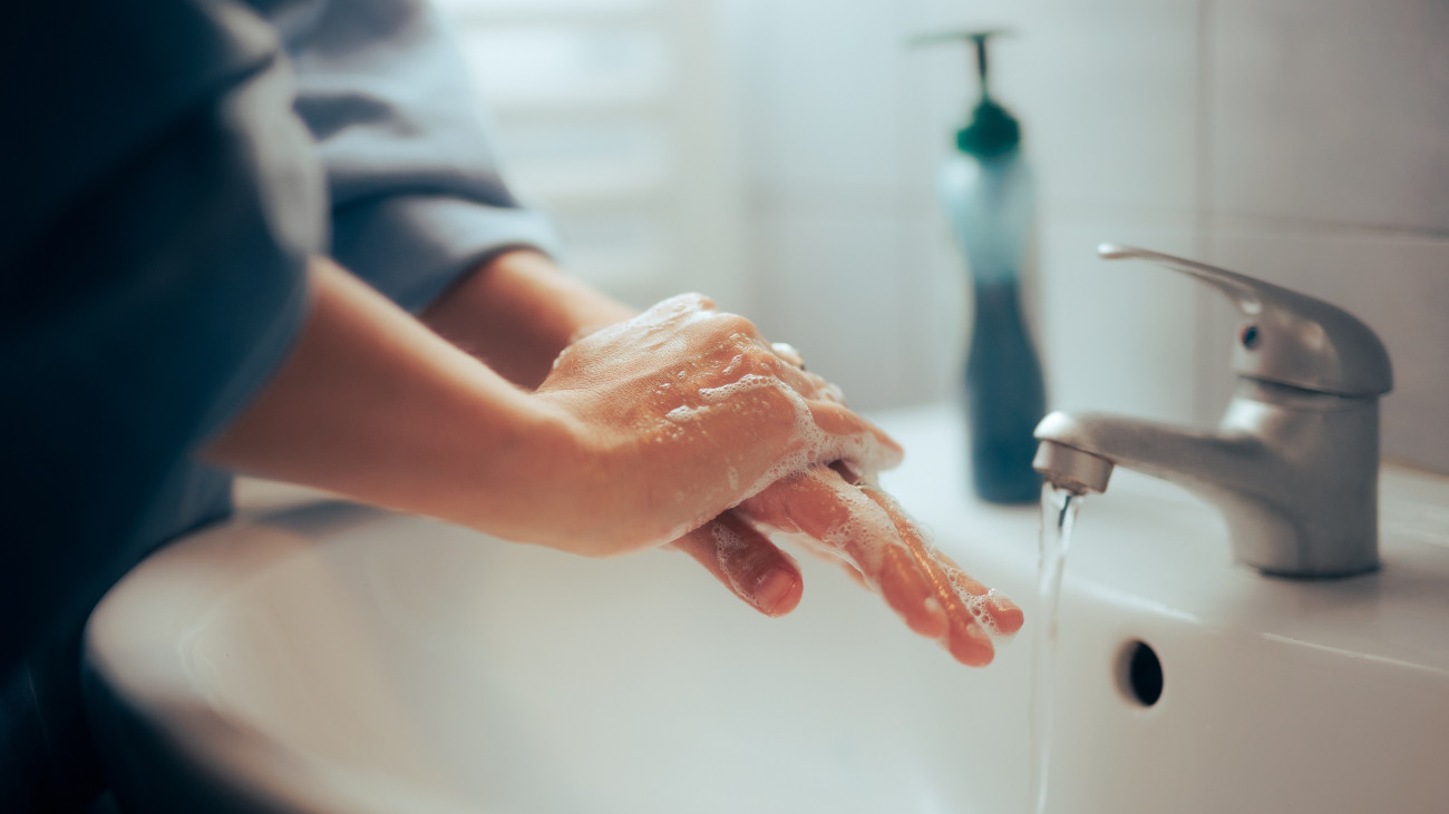 Woman cleaning off bacteria and germs in the washroom