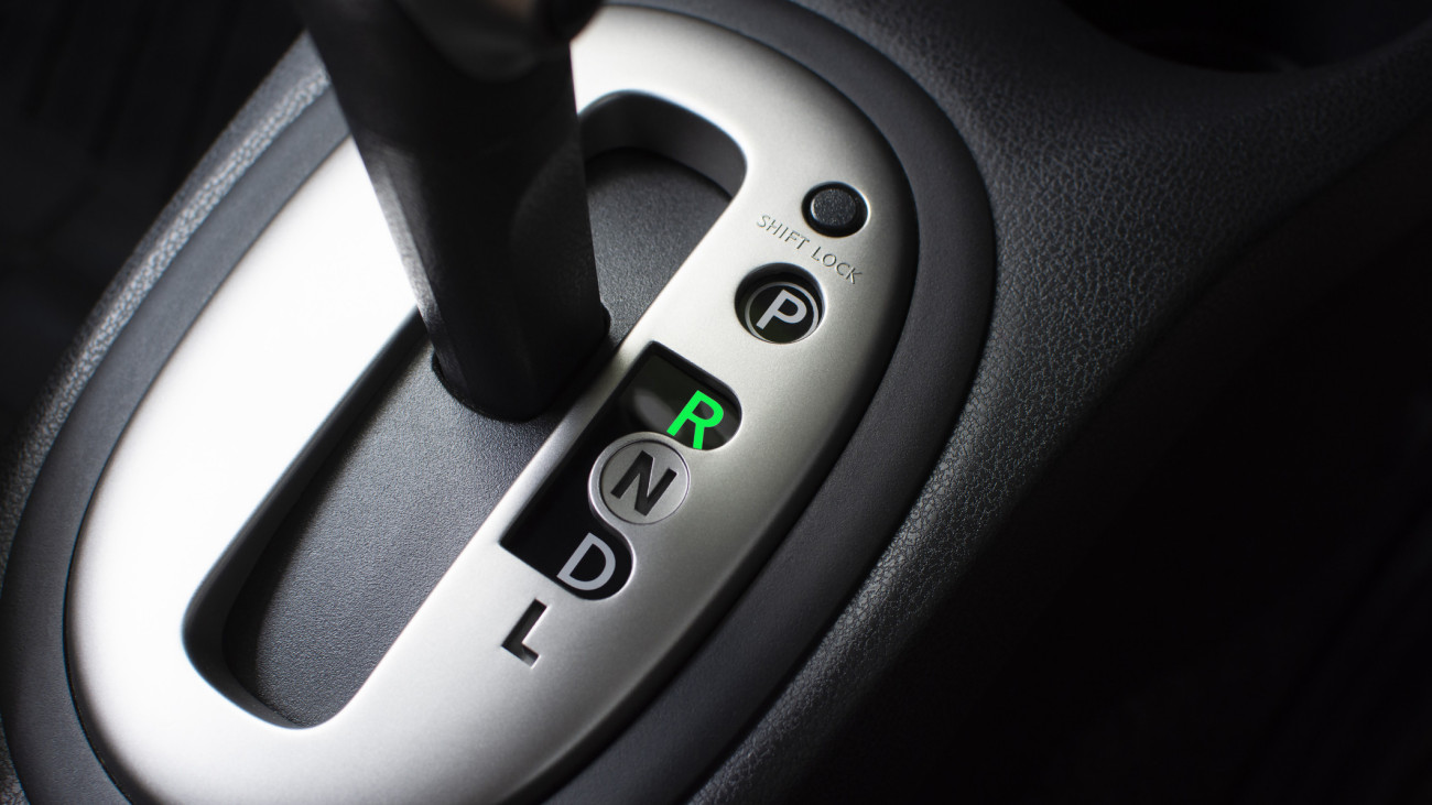 Put a gear stick into R position, (Reverse) Symbol in auto transmission car.